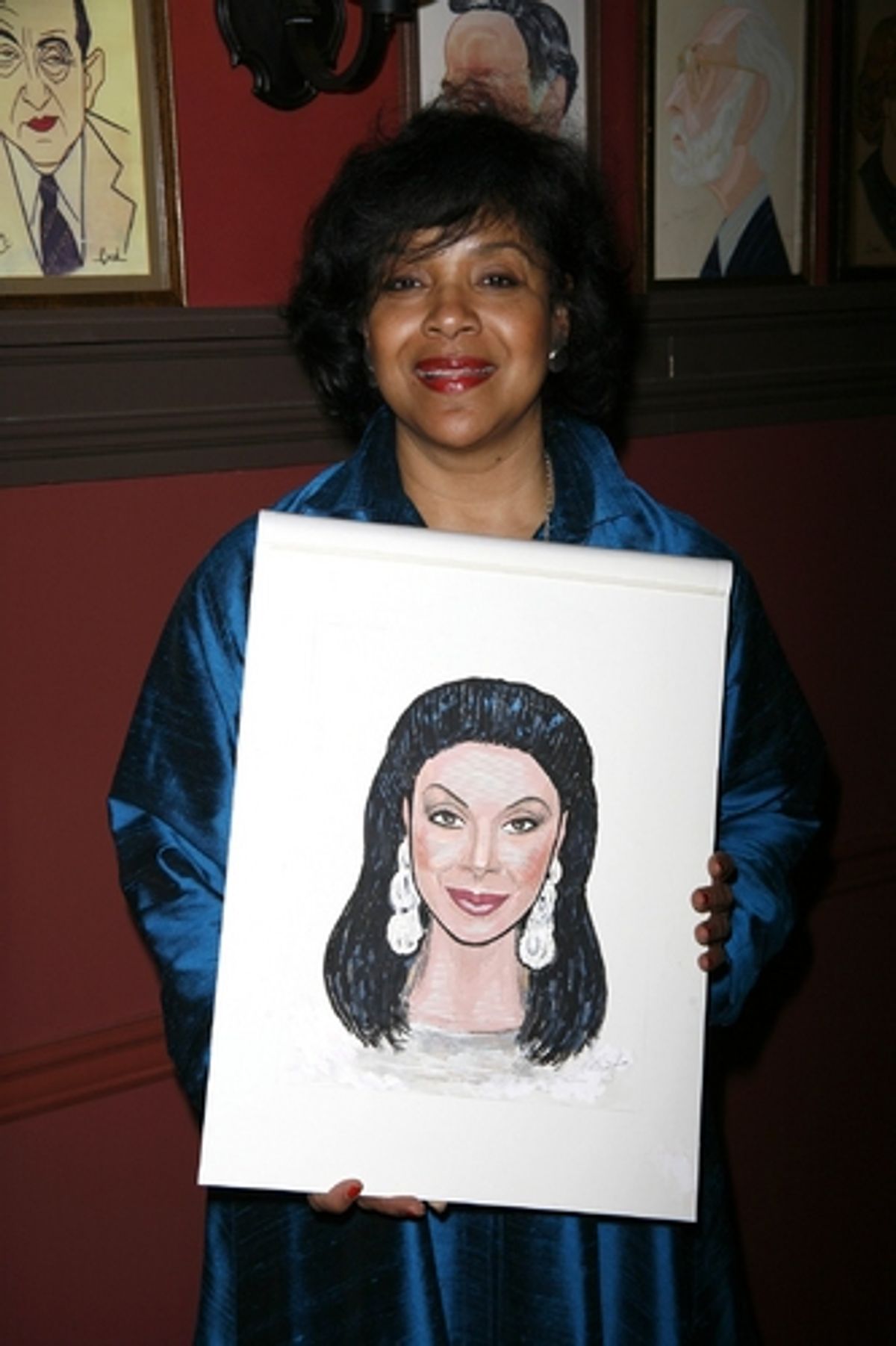 Phylicia Rashad with her caricature
 at 