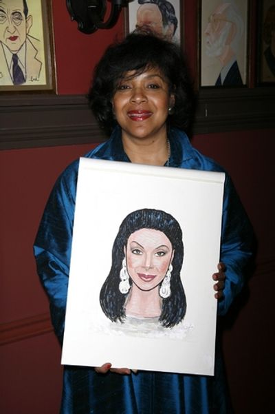 Phylicia Rashad with her caricature
 Photo