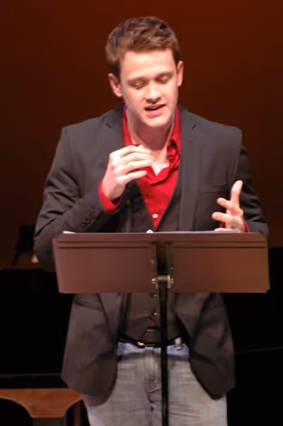 Michael Arden singing "And I Breathe" Photo