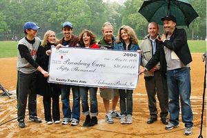 Bob Davis (along with BC/EFA's Frank Conway) presents the actors with a check for $50 Photo