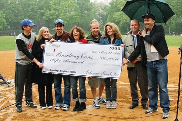 Bob Davis (along with BC/EFA's Frank Conway) presents the actors with a check for $50 Photo