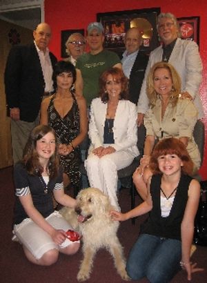 Back: John Schuck (Daddy Warbucks), Thomas Meehan (book writer), Robert Sher (CD producer), Charles Strouse (composer), Martin Charnin (original director and lyricist). Seated: Shelley Burch (Annie), Andrea McArdle (Annie), Kathie Lee Gifford (Miss Hanni @ BroadwayWorld Back: John Schuck (Daddy Warbucks), Thomas Meehan (book writer), Robert Sher (CD pro Photo