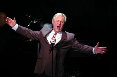 Walter Bobbie singing "You Mustn't Feel Discouraged" Photo