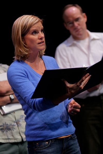 Jenn Colella with Michael Winther in the background Photo
