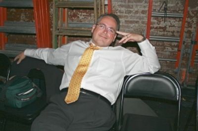 Brian Ash of the Capitol Steps, relaxing backstage before the show
 Photo