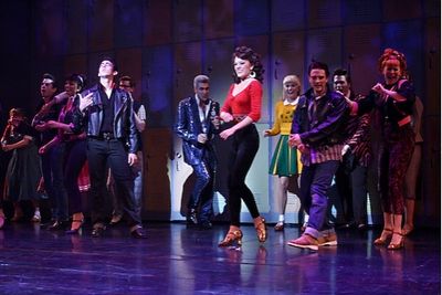 Max Crumm and Laura Osnes with the cast
 Photo