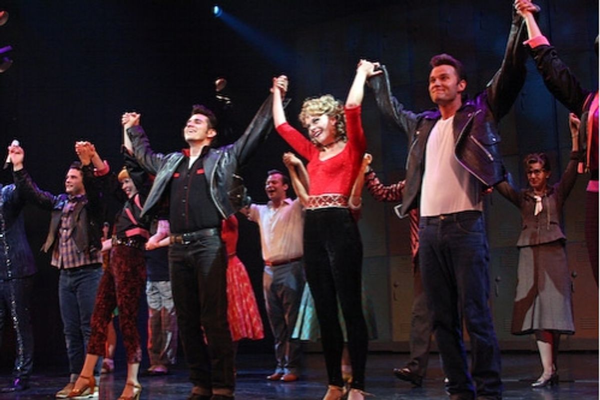 Derek Keeling and Ashley Spencer with the cast of Grease at 