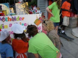 BKC members help Young Frankenstein's Kelly Sullivan pick out a handmade potholder Photo