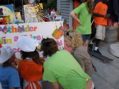BKC members help Young Frankenstein's Kelly Sullivan pick out a handmade potholder Photo