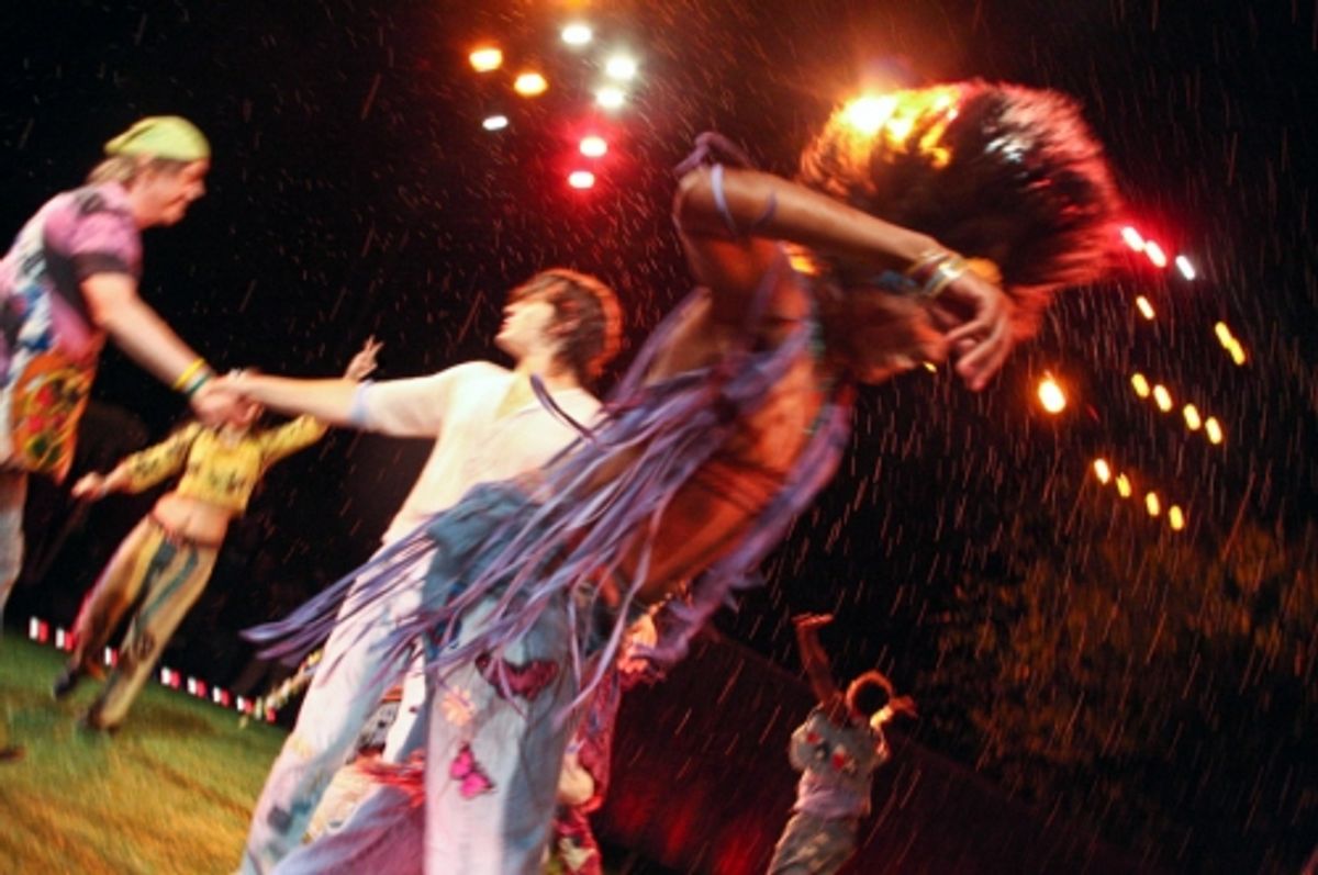 James Rado and Jonathan Groff come together as the cast dances around them
 at 