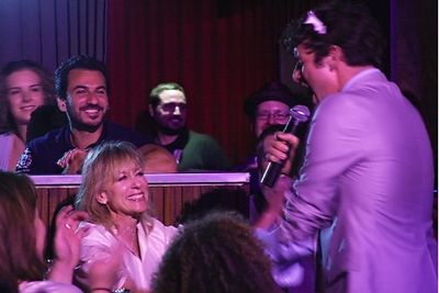 Michael Urie sings to audience member Judith Light Photo