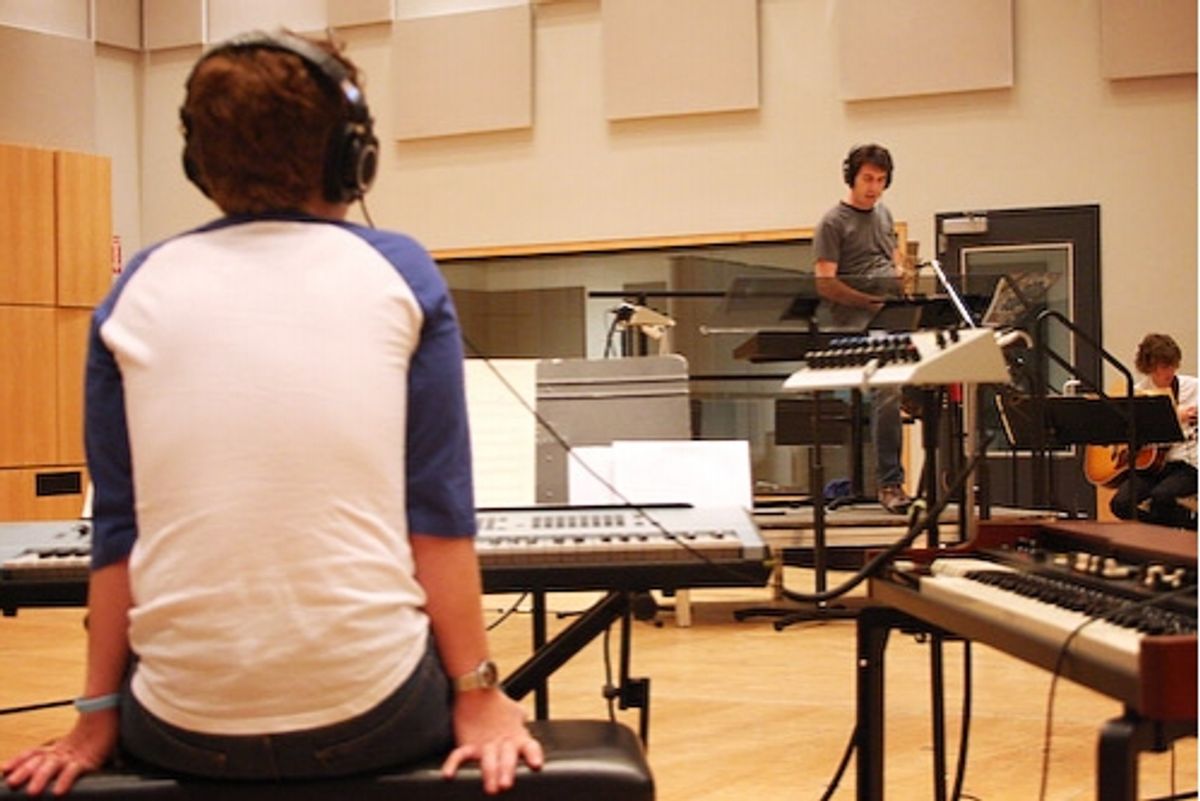 Jason Robert Brown conducts the band at 