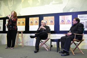 Lisa Asher singing with Peter Filichia and Ellis Nassour looking on

 Photo