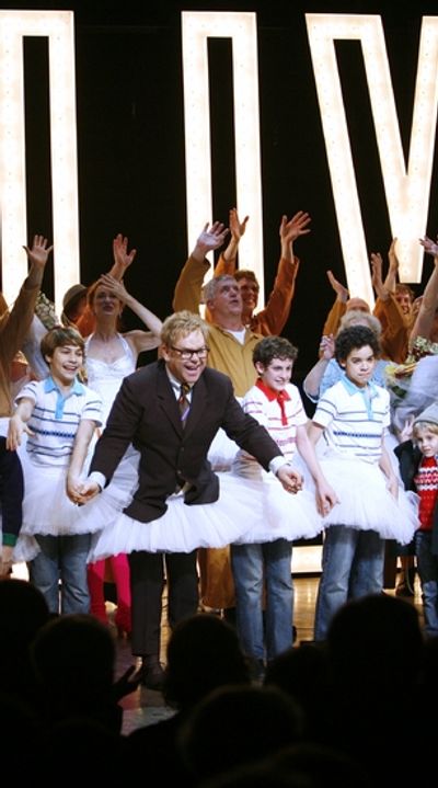 Kiril Kulish, Elton John, Trent Kowalik and David Alvarez Photo