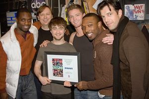 The Daniel Radcliffe and the cast of EQUUS pose with their fundraising award Photo
