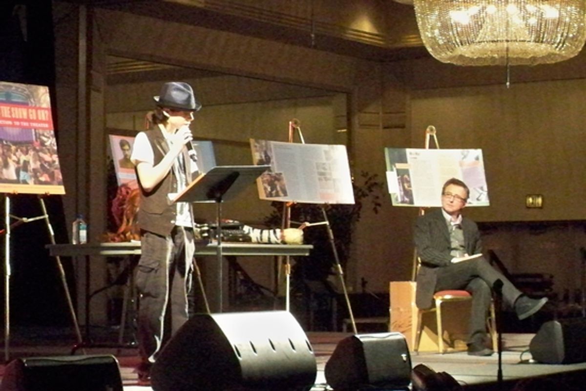 Henry Hodges assists Thomas Schumacher during his Keynote Speech at 