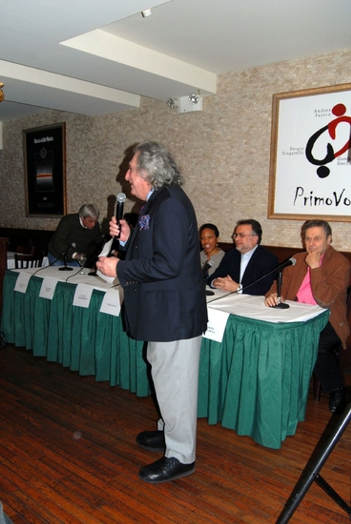 William Wolf introduces the panel at 