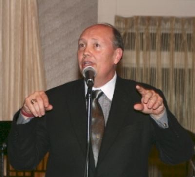 Emcee David Coffee is no Scrooge at this benefit Photo