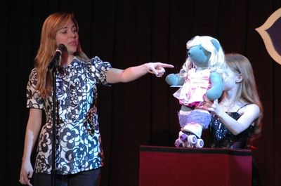 Kerry Butler pointing out all the details on the Kira Bear Photo