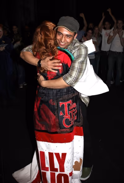 Manuel Herrera hugs Lorin Latarro

 Photo