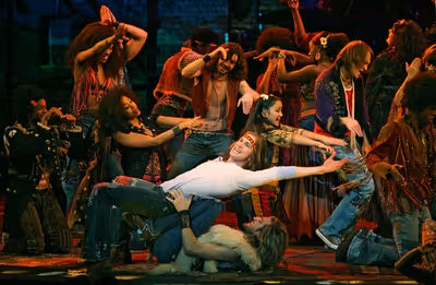 Gavin Creel, Bryce Ryness and the cast

 Photo
