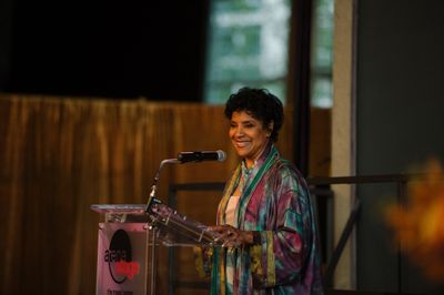 Phylicia Rashad, honorary event chair, gives remarks during a seated pre-show dinner Photo