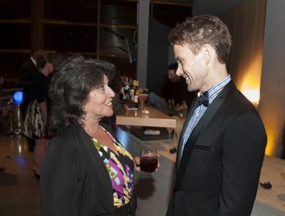 Christopher J. Hanke chats with an event attendee Photo