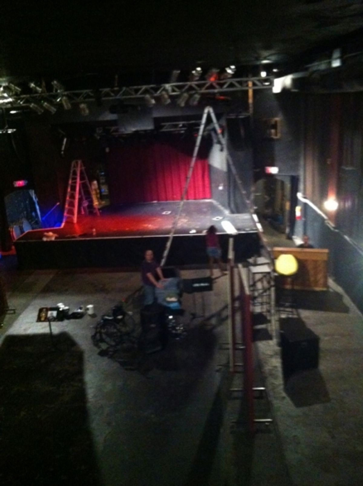 Producer David Rogers, creator Steven Mitchell, and lighting designer Brittany Mellerson in the theater on load-in day  at 