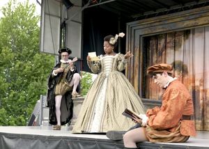 Bianca (Tiffany Yvonne Cox) is tutored by two suitors, Hortensio (L: Matthew Sherbach Photo