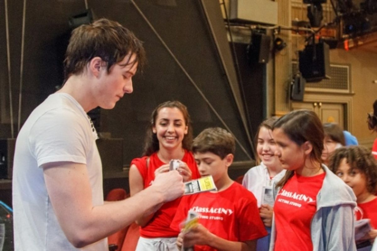Broadway's Matthew James Thomas signs autographs after having a talk back with our student's after seeing Spider-Man: Turn Off The Dark. at 