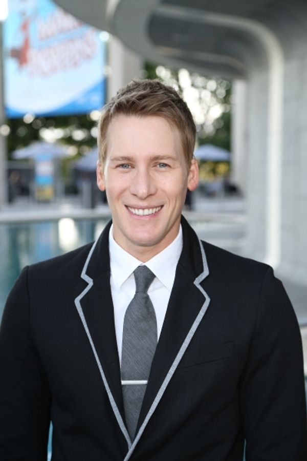 Writer Dustin Lance Black poses during the arrivals for the opening night performance Photo