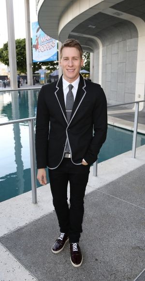 Writer Dustin Lance Black poses during the arrivals for the opening night performance Photo