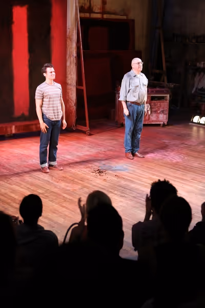 Cast members Jonathan Groff, left, and Alfred Molina, right, bow at the curtain call  Photo