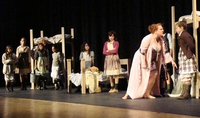 Brigid Harrington (center) as Annie, Caitlin Hughes as Miss Hannigan, and Emily Gulde Photo