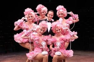 Noah Racey as Bobby Child surrounded by ensemble (right, clockwise) Robin Masella, Kr Photo