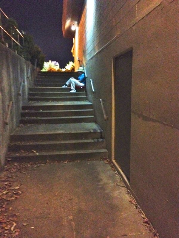 Sister Berthe (Michelle Elmore) steals some alone time in the alley. Photo