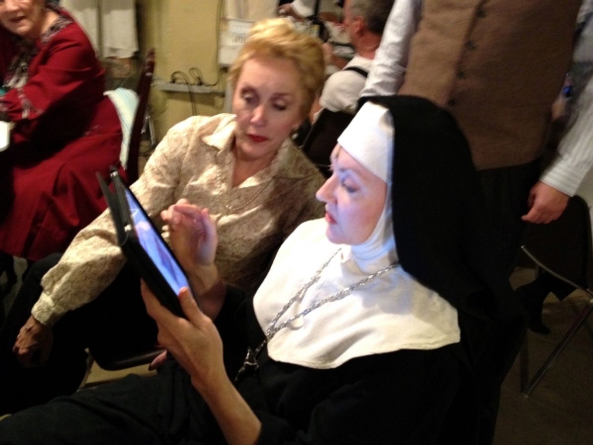 The iPad looks a LITTLE out of place in the hands of Mother Abbess (the GLORIOUS Suzanne Ishee).  But Suzanne doesn't care!  She and Kari Ely are having a youtube break. at 