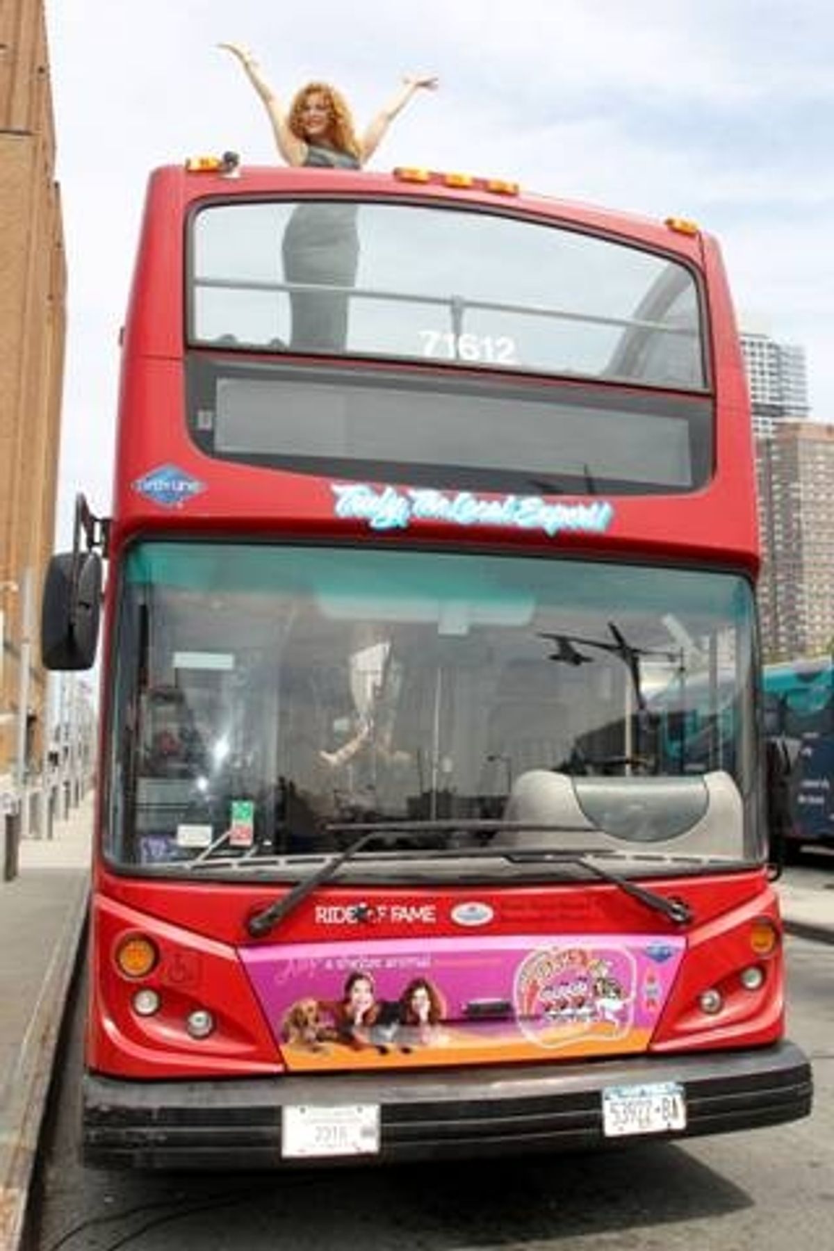 Bernadette Peters atop her Gray Line New York Ride of Fame double-decker bus at 