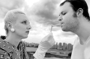 Angie Atkinson lights Doug Sharf's cigarette as Jo and Ant Knee, after escaping the Judge's grasp. @ BroadwayWorld Angie Atkinson lights Doug Sharf's cigarette as Jo and Ant Knee, after escaping the J Photo