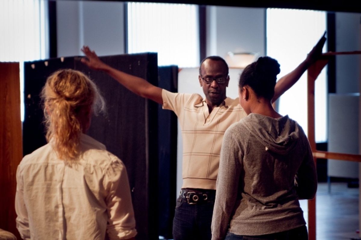  Ensemble member K. Todd Freeman (center) directs ensemble members Mariann Mayberry (left) and Alana Arenas (right)  at 