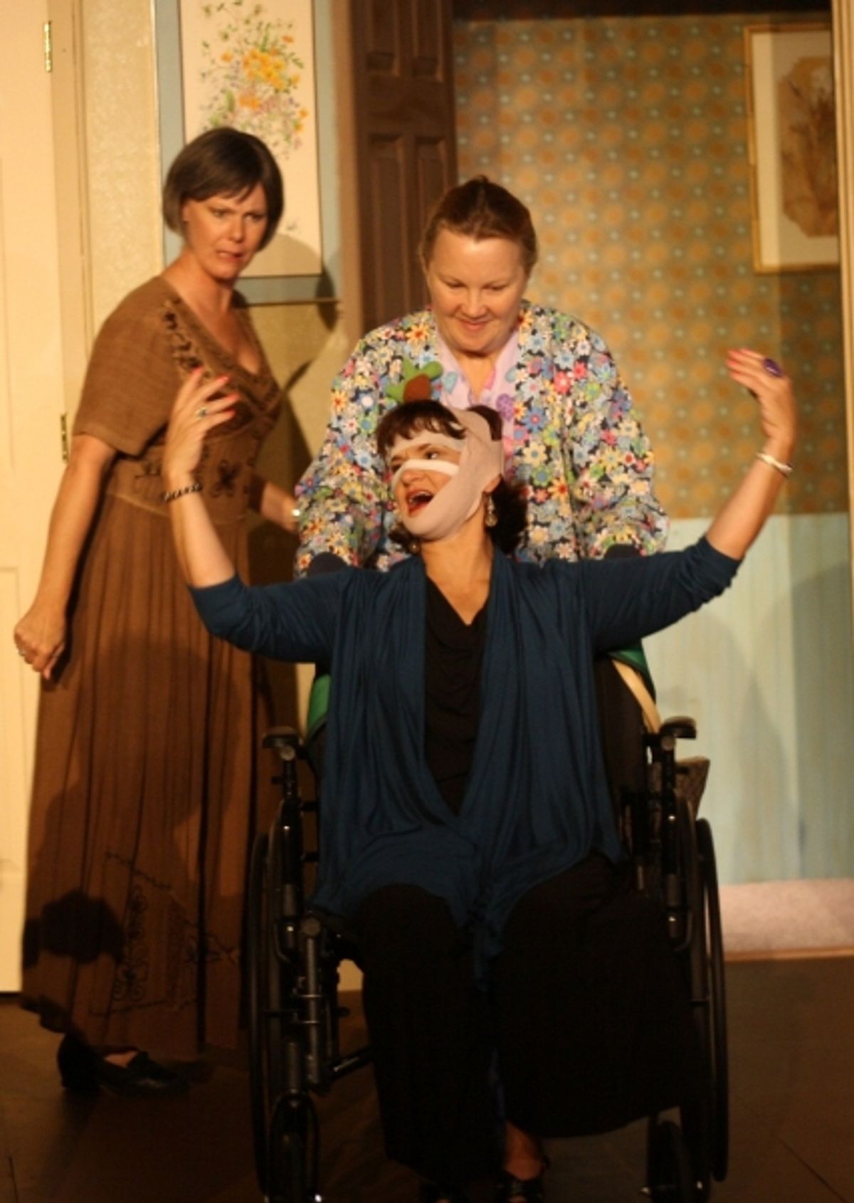  Barbie Weisserman (Mia) is surprised to see Nancy Cooper (Kitty) in a wheelchair accompanied by her nurse, Barbara Bicknell (LuAnne) at 