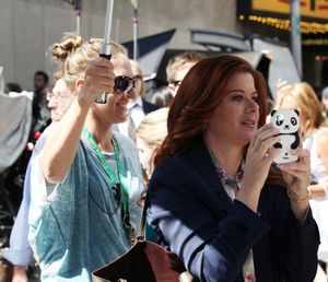 Debra Messing photographing 'Naked Cowboy' @ BroadwayWorld Debra Messing photographing 'Naked Cowboy' Photo