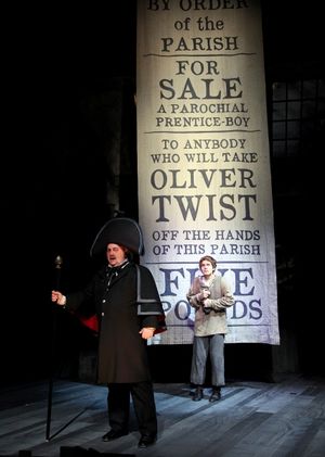 Eric Hoffmann as Mr. Bumble, a parish beadle and (rear) Quentin McCuiston as Oliver Twist
@ BroadwayWorld Eric Hoffmann as Mr. Bumble, a parish beadle and (rear) Quentin McCuiston as Oliver T Photo