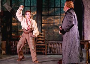 The Artful Dodger played by Robbie Collier Sublett threatens Fagin, the receiver of stolen goods played by Ames Adamson @ BroadwayWorld The Artful Dodger played by Robbie Collier Sublett threatens Fagin, the receiver of s Photo