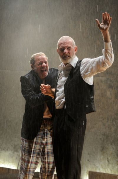 : Stephen Berenson as The Fool and Brian McEleney's King Lear are caught in the rain  Photo