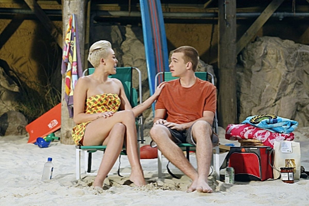'You Know What the Lollipop is For'--Jake (Angus T. Jones, left) spends time with Missi (special guest star Miley Cyrus, right) at the beach, on TWO AND A HALF MEN, Thursday, Oct. 18 (8:30-9:00 PM, ET/PT) on the CBS Television Network.  Photo: Greg Gayne/ at 
