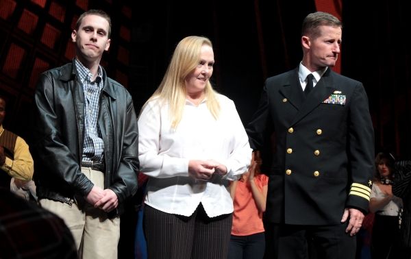 Command Master Chief Matthew E. Danforth and the family of Michael Murphy Photo