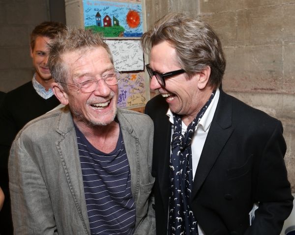 From left, cast member John Hurt is greeted by actor Gary Oldman backstage after the  Photo