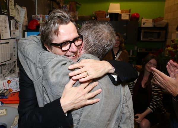 From left, actor Gary Oldman hugs cast member John Hurt backstage after the opening n Photo