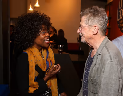 From left, actress Charlayne Woodard congratulates cast member John Hurt during the p Photo